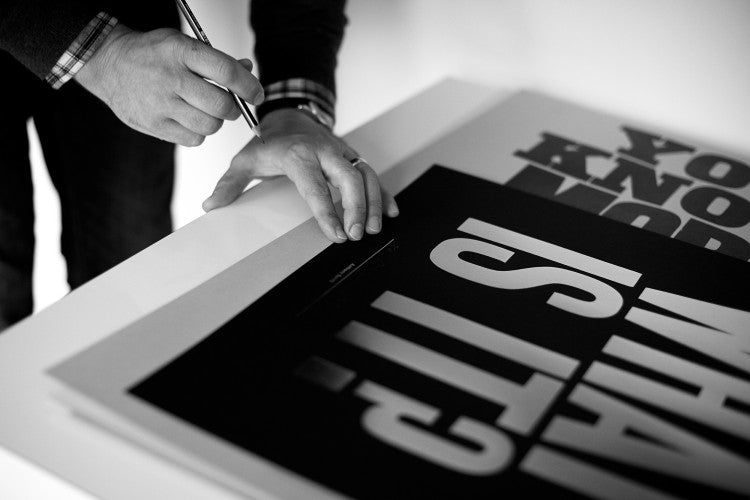person working on a poster