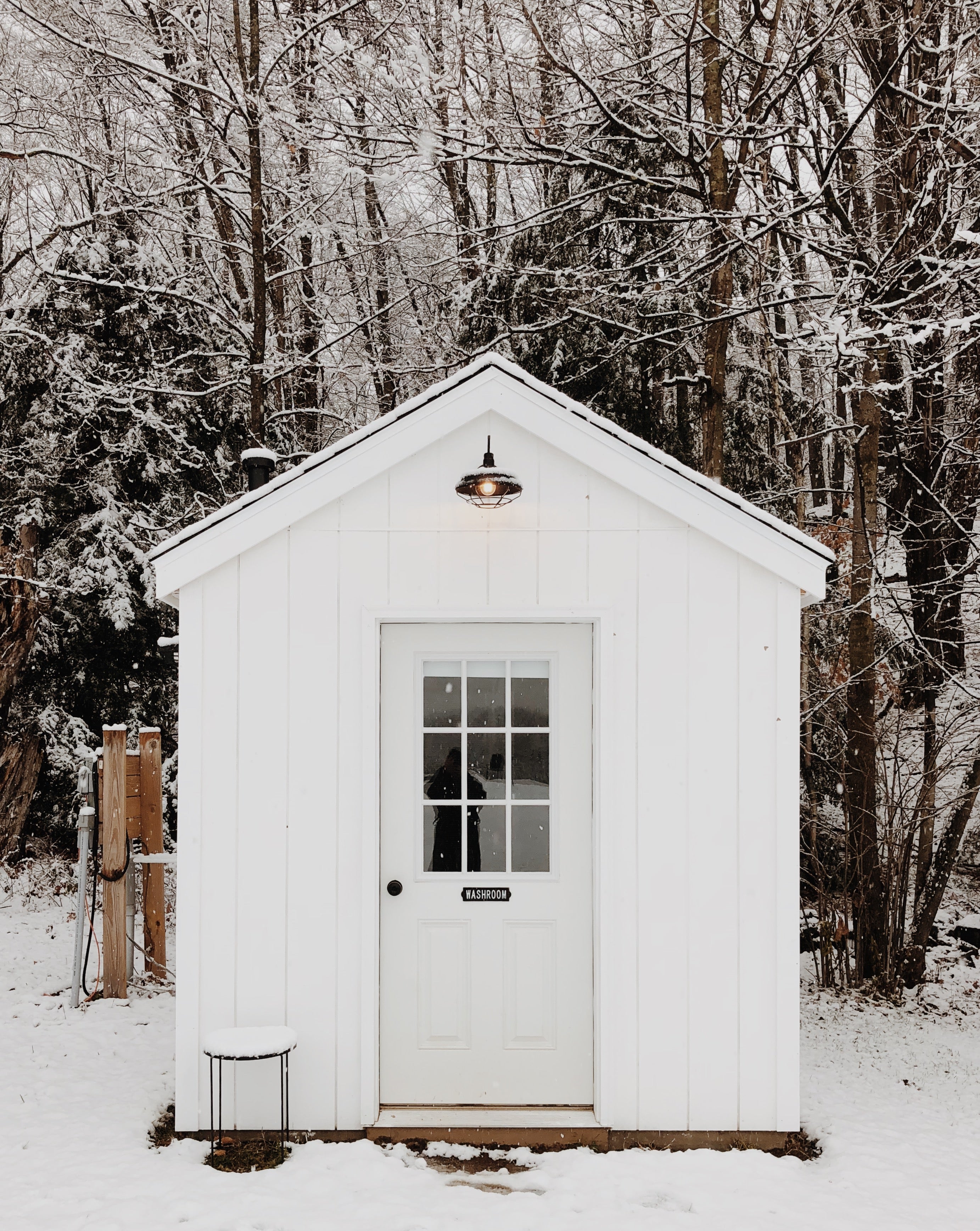 small white shed in the snow
