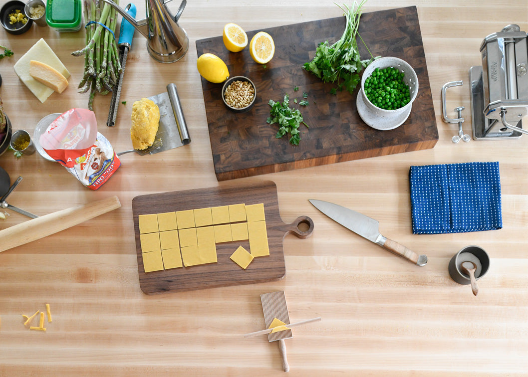 wooden kitchen counter with cutting board and knife