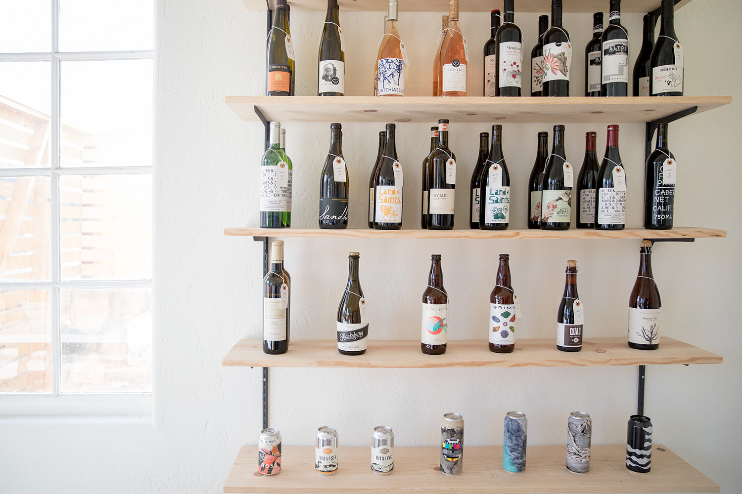 shelf with bottles and cans on it