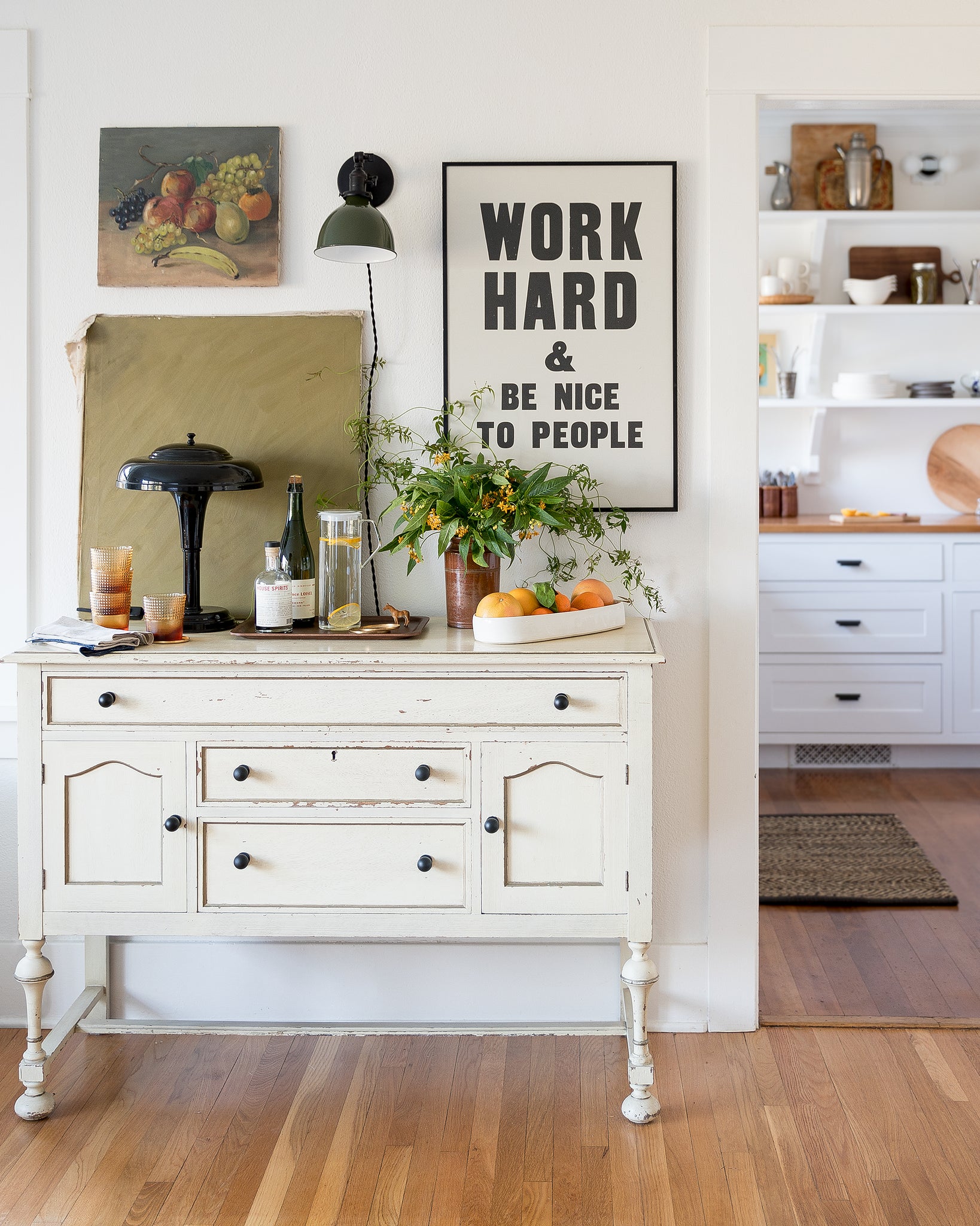 white cabinet and wall decorations