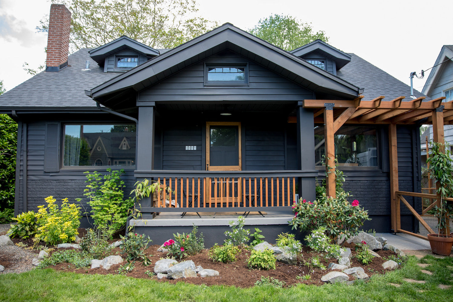 black house with a porch