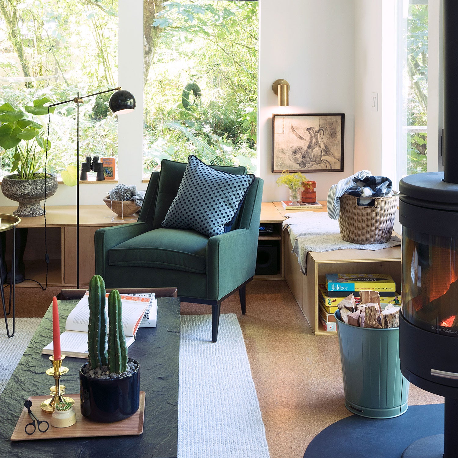 living room with a blue couch and a table with plants