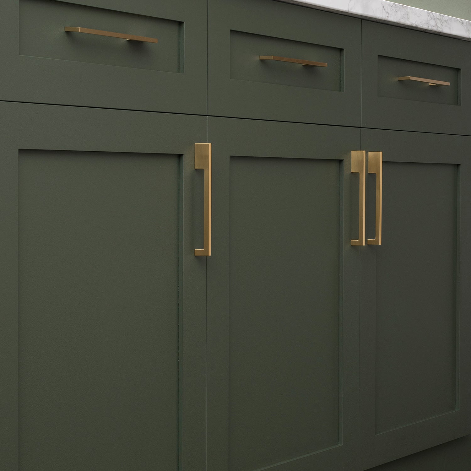 green cabinets with handles