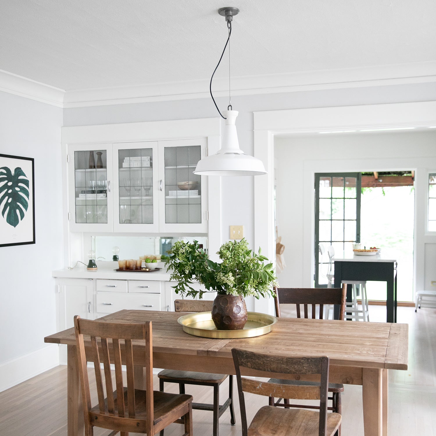 kitchen with a table and chairs and ceiling light fixture