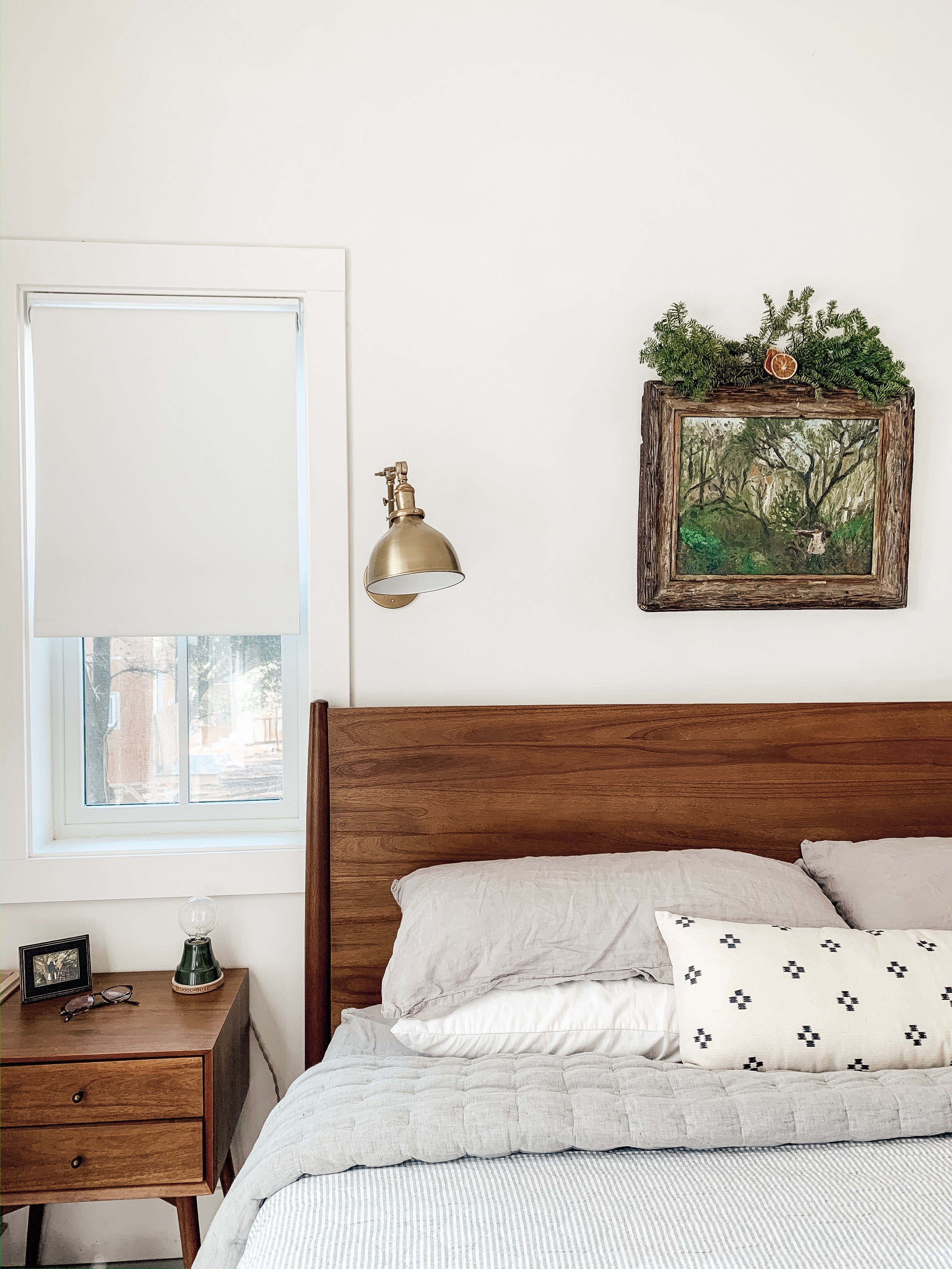 bed with a wood headboard and gray bedspread