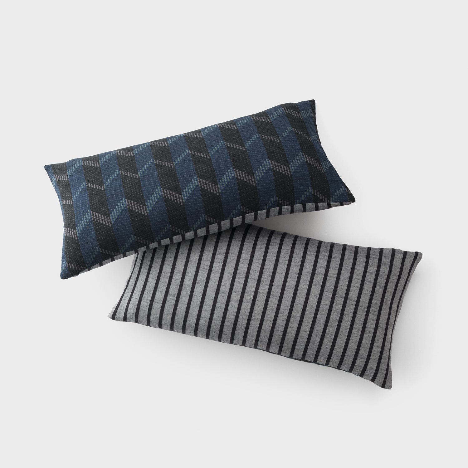 pair of blue and black striped pillows
