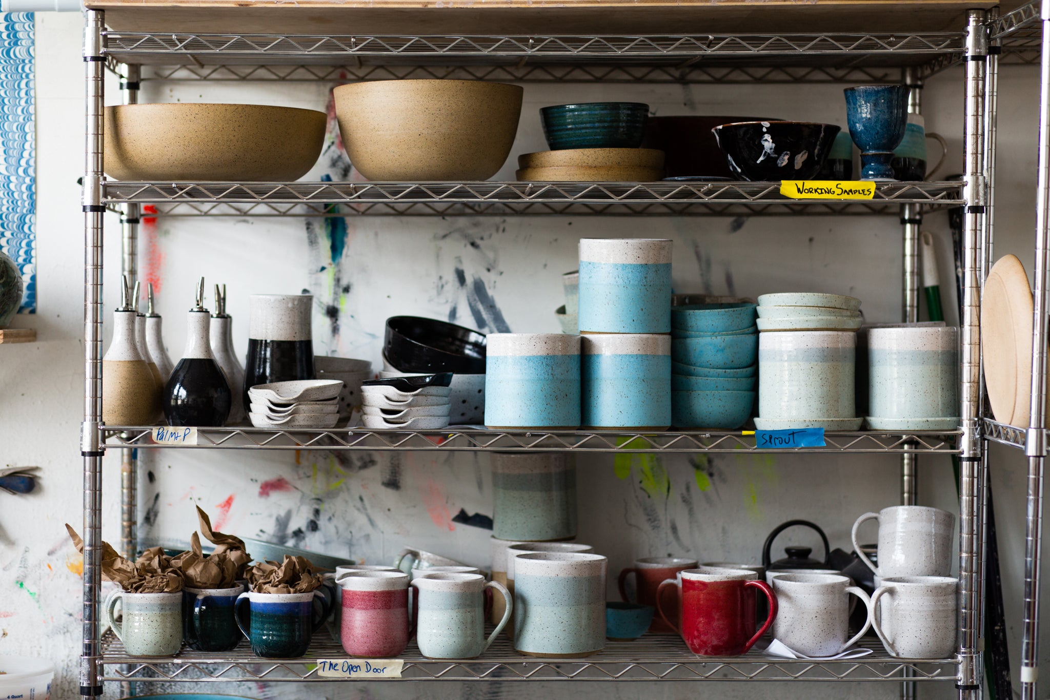 shelf with many cups and dishes on it