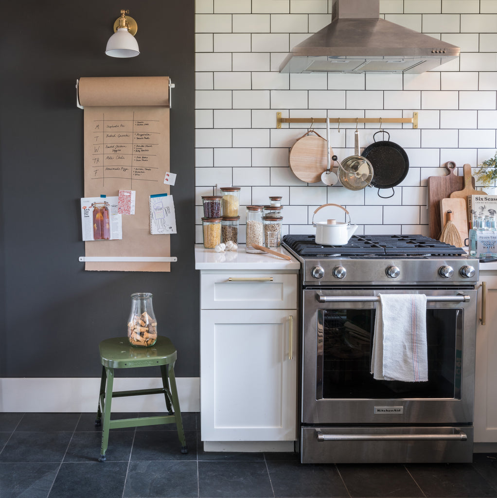 kitchen with a stove and a stool