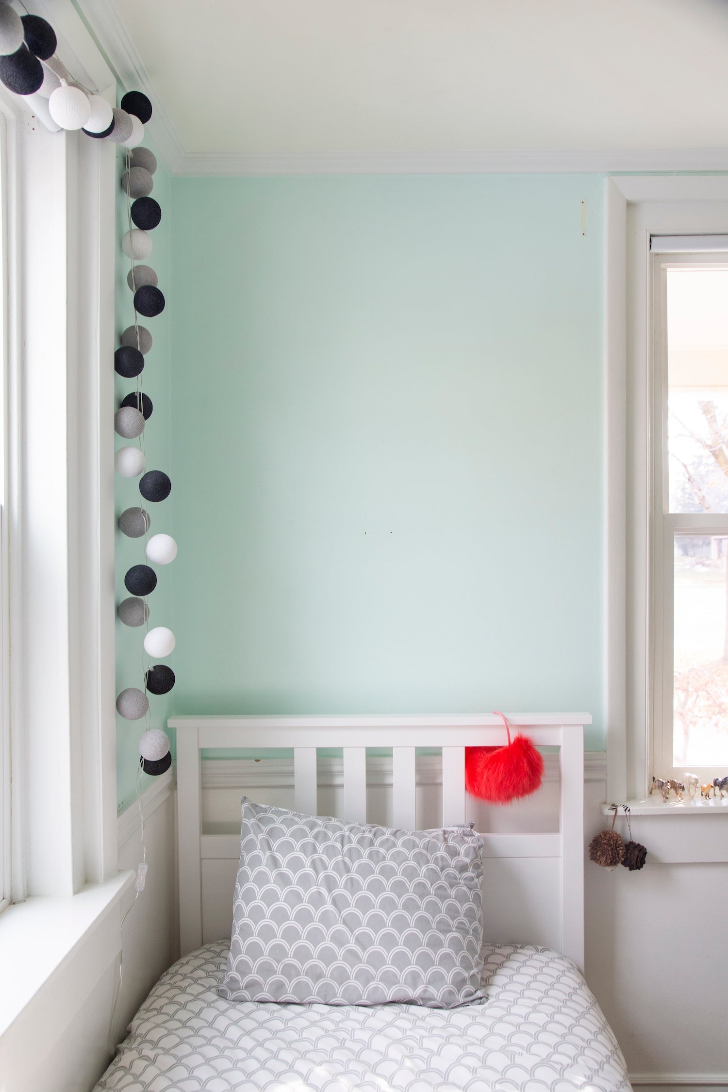 bed with a white sheet and a headboard