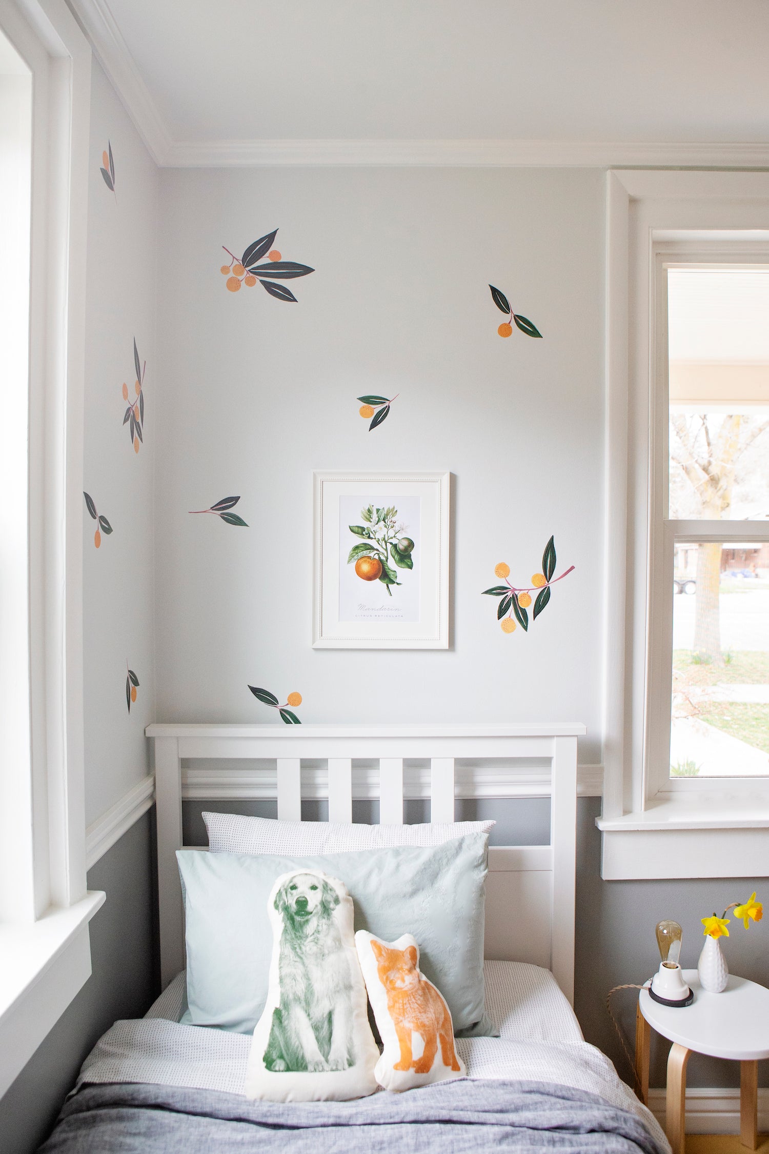 room with a bed and a window with a stuffed animals 