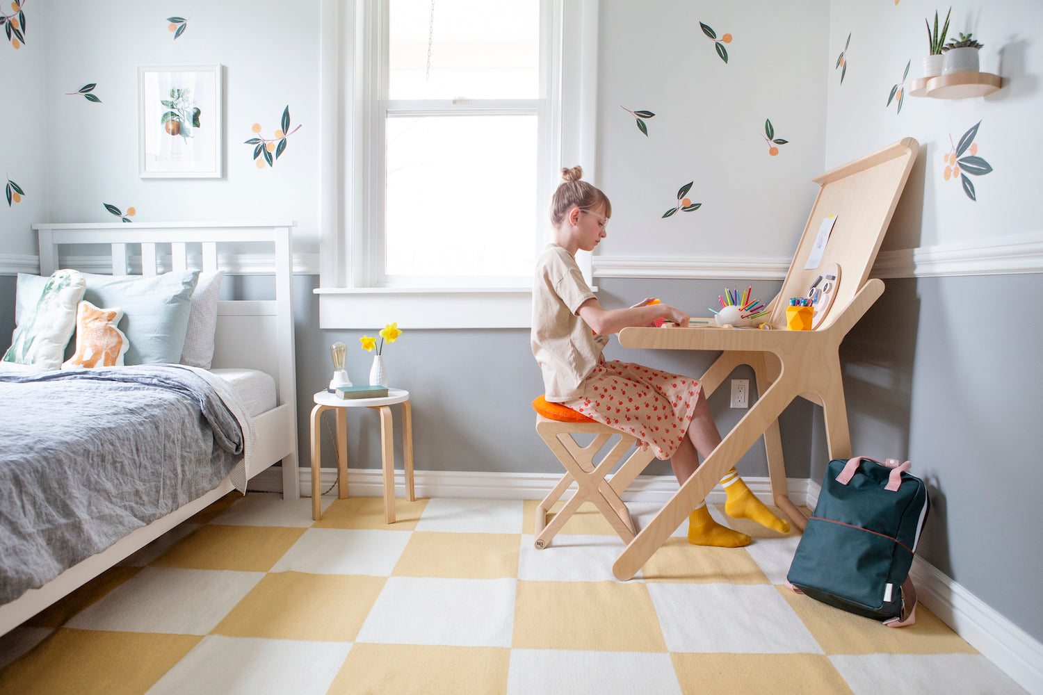 girl sitting on a chair in a bedroom