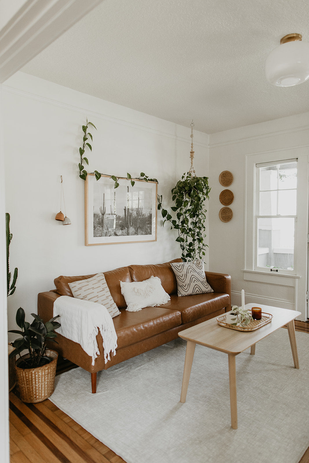 living room with a brown couch and a coffee table