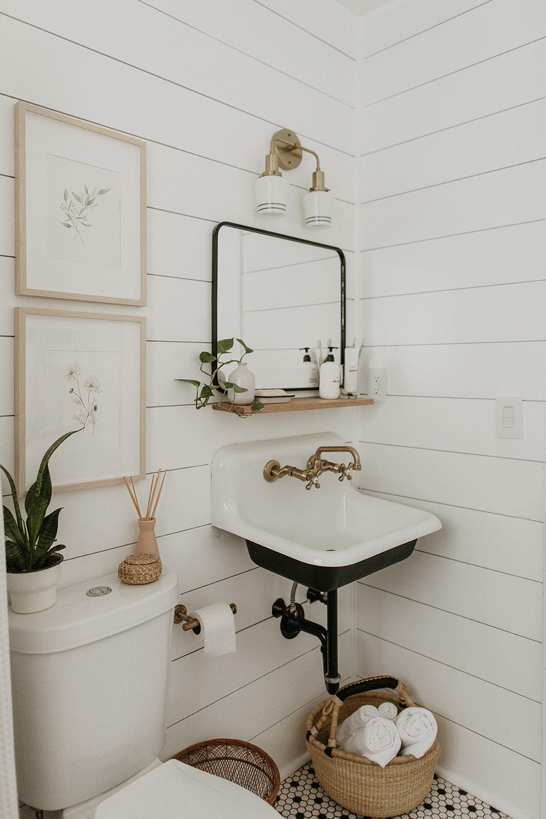 bathroom with a basket and a sink