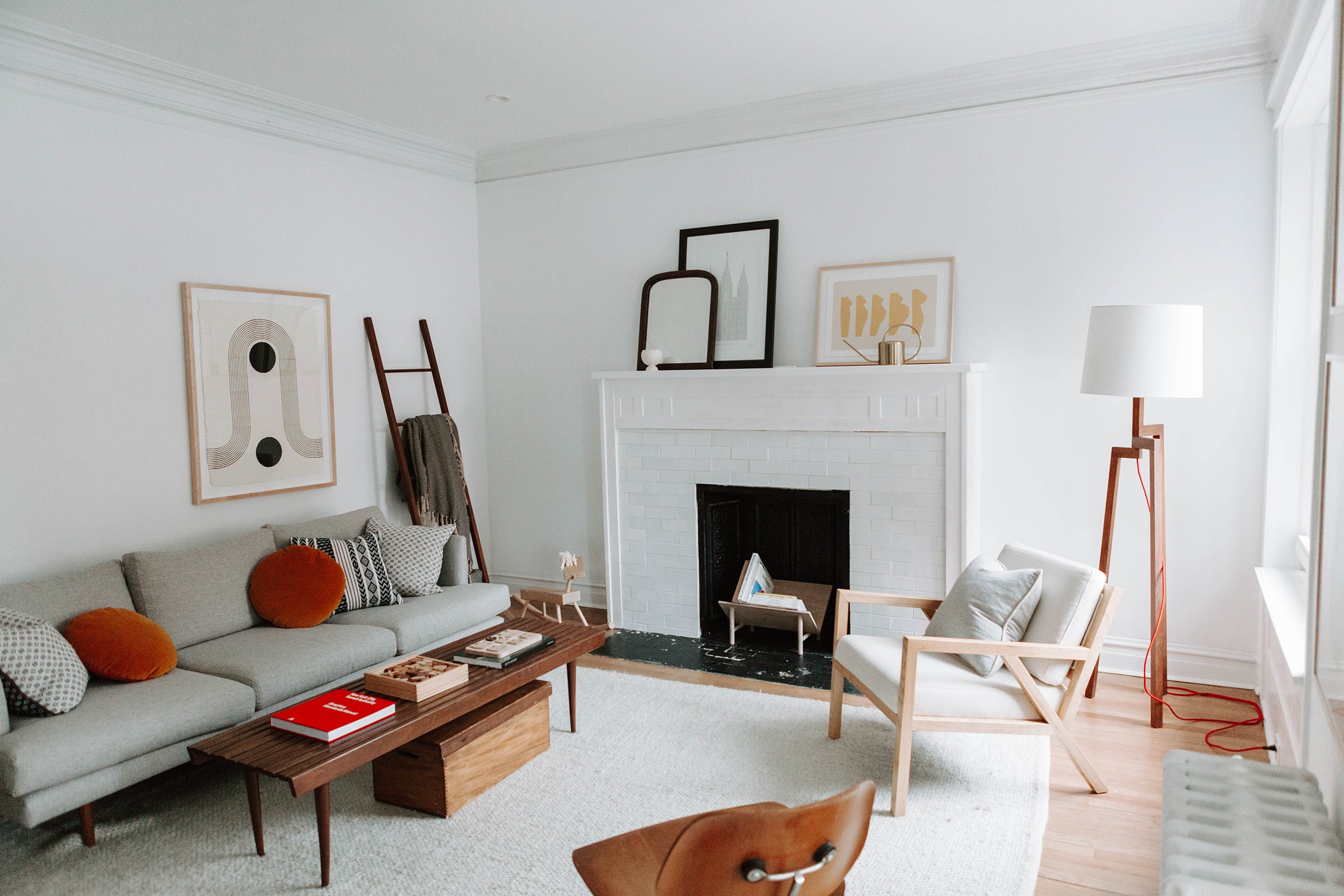 living room with a fireplace and a gray couch