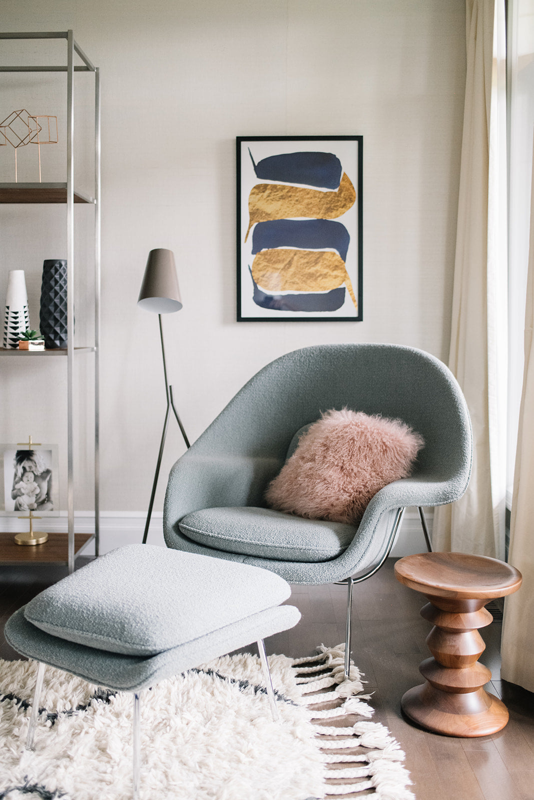 blue chair in a room with textured pillow