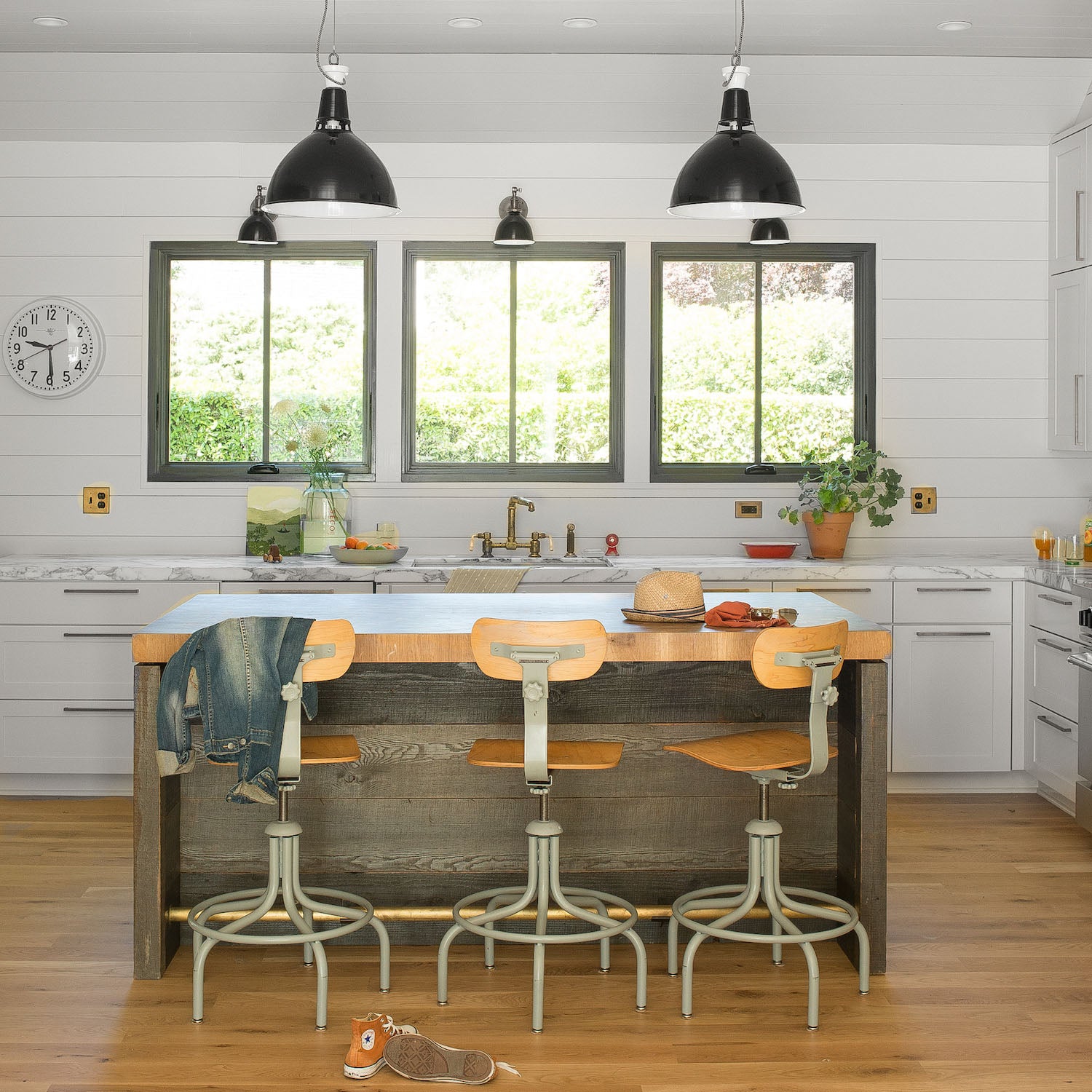 kitchen with a table and chairs and windows