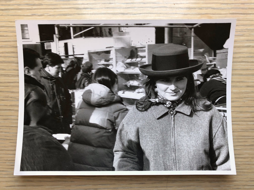 black and white photograph of person wearing a hat