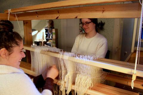 Kira and Emily threading the heddles and laughing