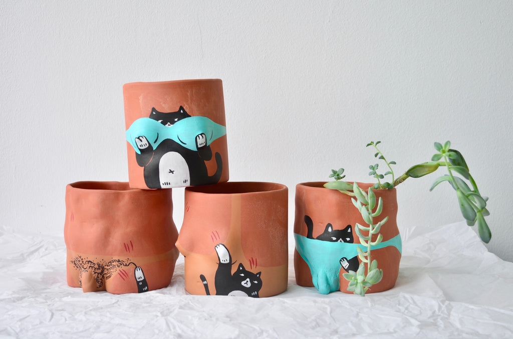 Handpainted terracotta pots | Ly Yeow