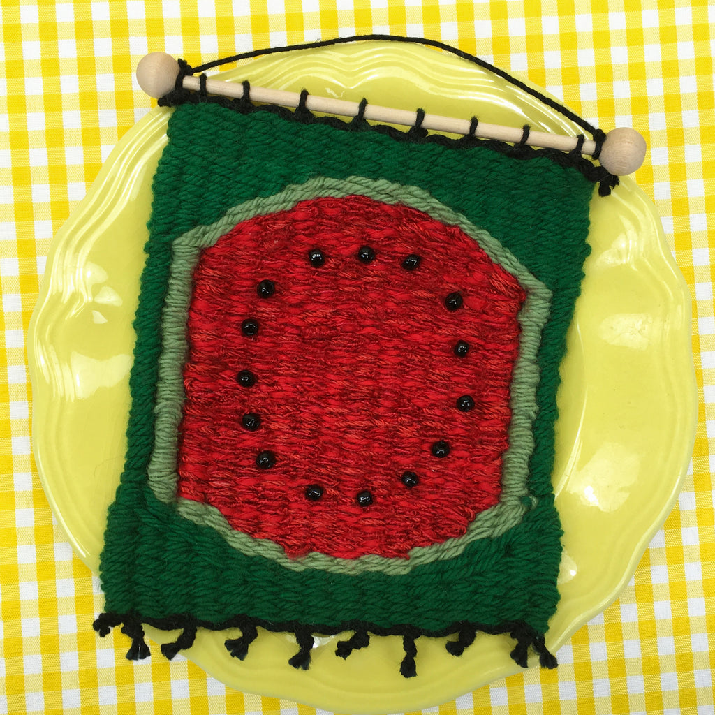 little loom weaving a watermelon