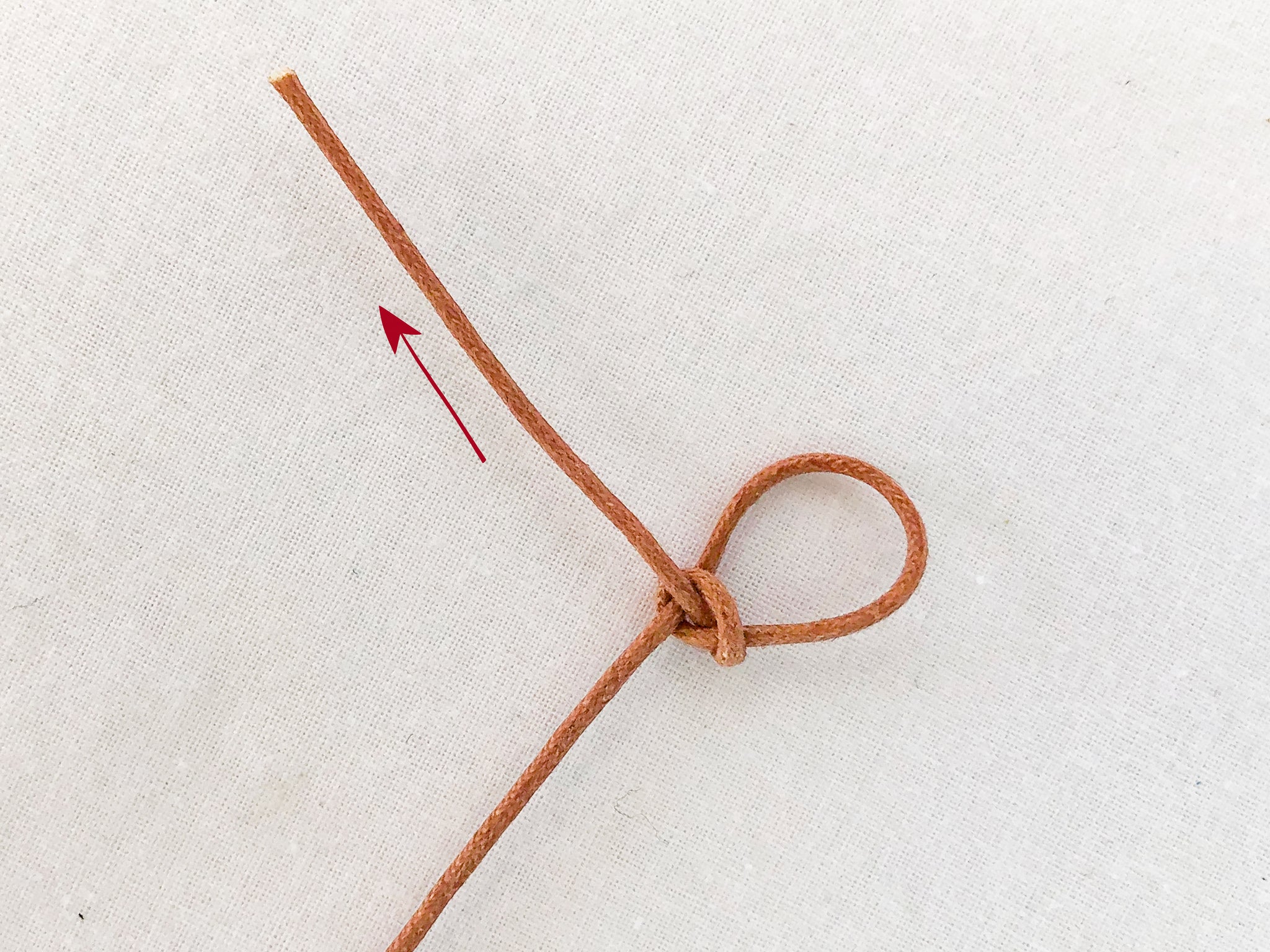How to tie a slip knot step 4
