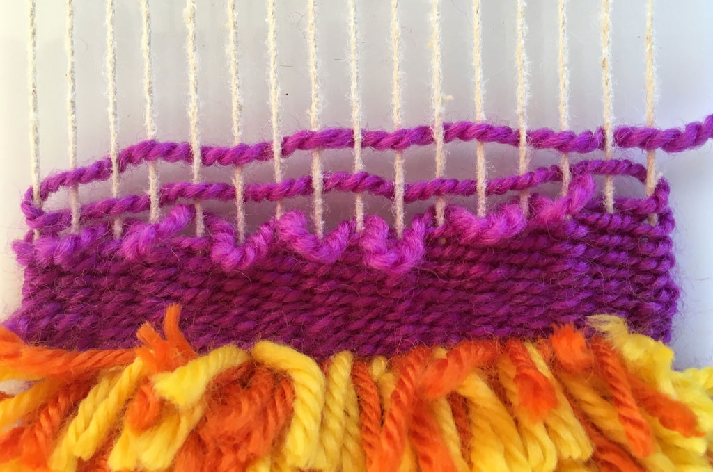 weaving over a row of loops