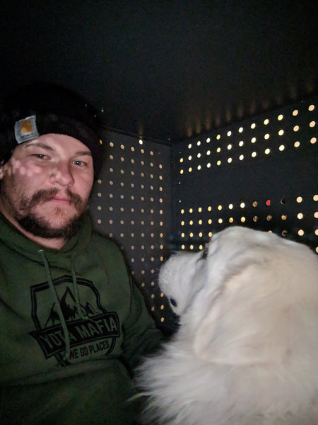 guy and great pyrenees dog in impact dog crate