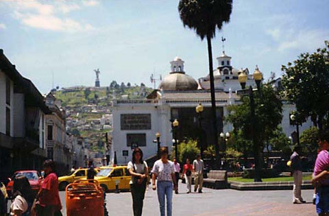 Old Quito Square. Our Lady of Quito is seen on top of the mountain on left.