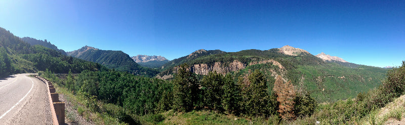A panoramic image of mountains and trees