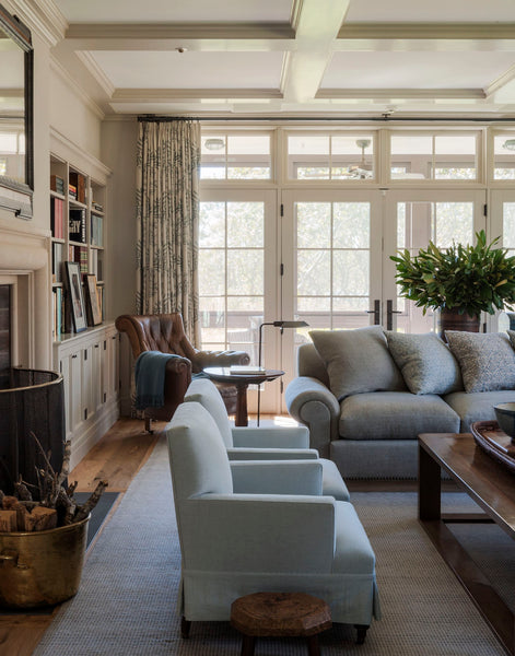 Living space with rustic vase and wood basket