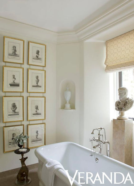 Bust and gallery wall in bathroom