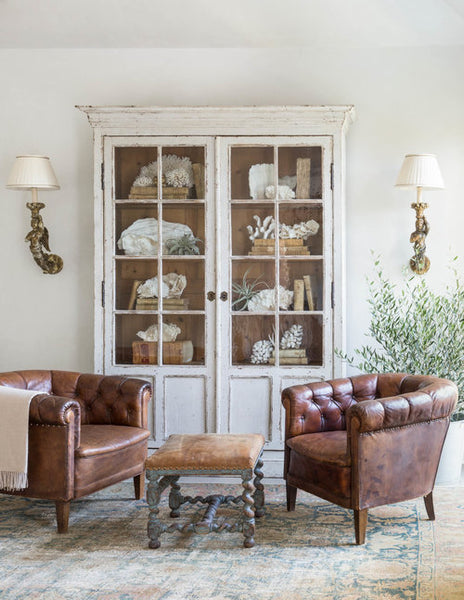 Armoire with glass doors leather club chairs and wall sconces buy online from France French wedding present