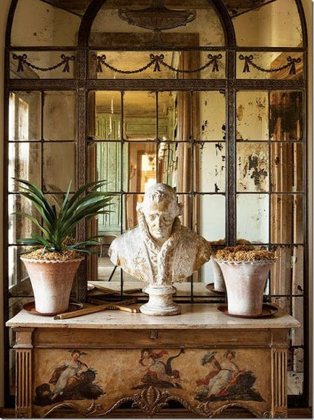 Symmetrical vignette commode with bust and flower pots