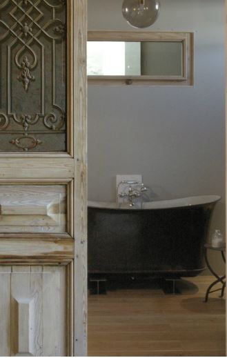 Salvaged door rustic bath mirror French chair Helmkampf
