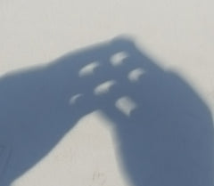 Eclipse through my fingers