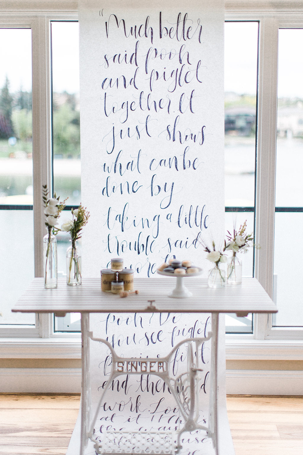 honey_on_table_with_flowers_calligraphy