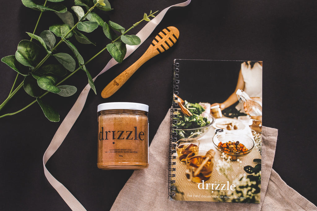 Drizzle Holiday Spiced Honey, Recipe book and honey dipper displayed top down