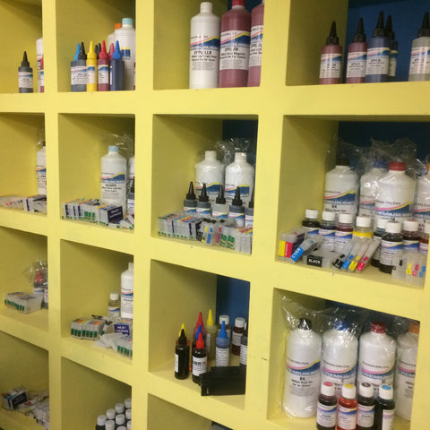 Ink refill bottles and refillable cartridges on the shelf at Premium Inks Louth computer shop.