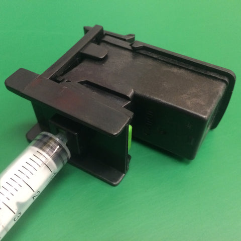 Click PG545 black cartridge into the refill clip and fit syringe.  Pull back on the lever to prime the cartridge.