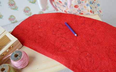 Lucy Owl's heart shaped designs on red felt for Valentines