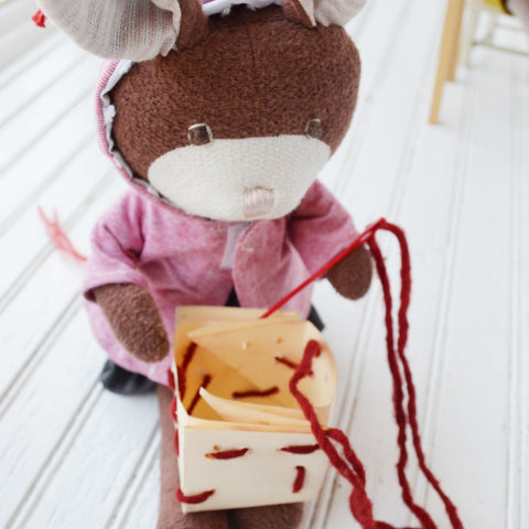 Zoe Rabbit sewing her cardboard box