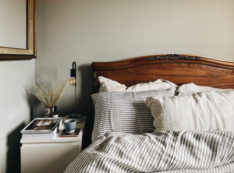 A bed with sustainable striped bed linen made in the UK | Aerende
