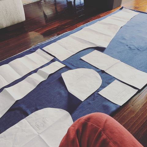 Laying out the pattern of the Palisade Pants on the floor for cutting