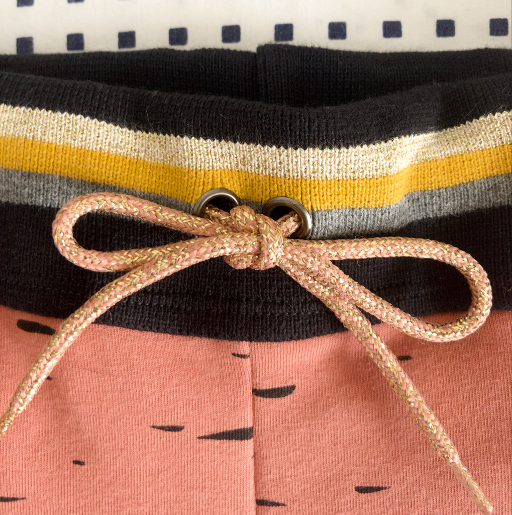 close up of folded cuff and shoelace waistband