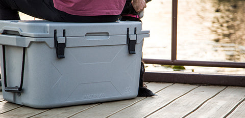 On the dock with a Bison Cooler