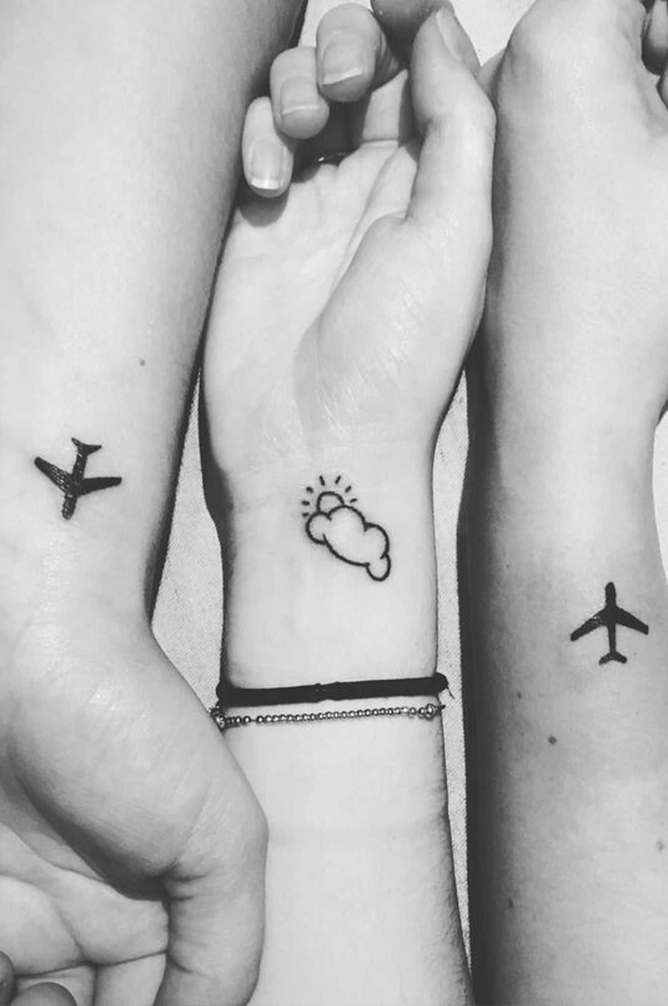 Small Simple Wrist Tattoo Ideas for Travelers - Airplane and Cloud Arm Tatt at MyBodiArt.com