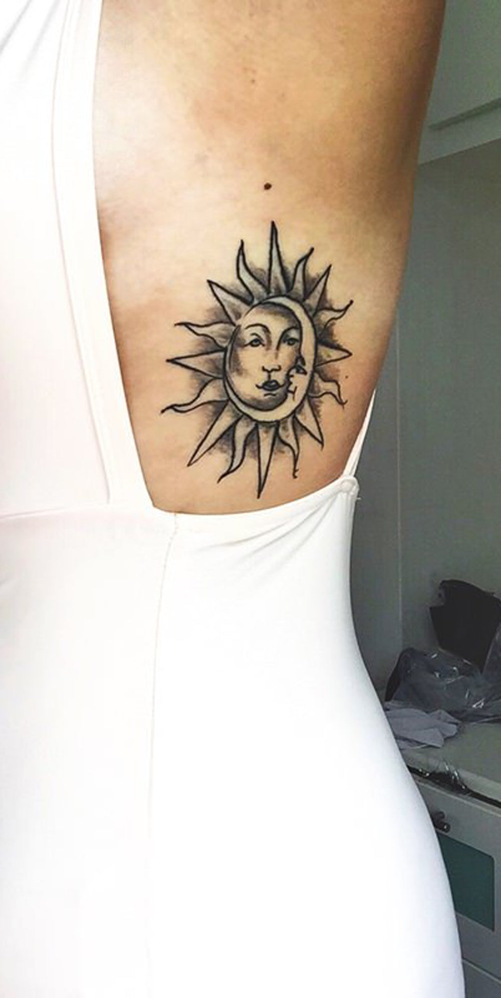 Tribal Sun Rib Tattoo Ideas for Women -  Black Moon Side Tatt -  ideas de tatuaje de costilla para mujeres - www.MyBodiArt.com