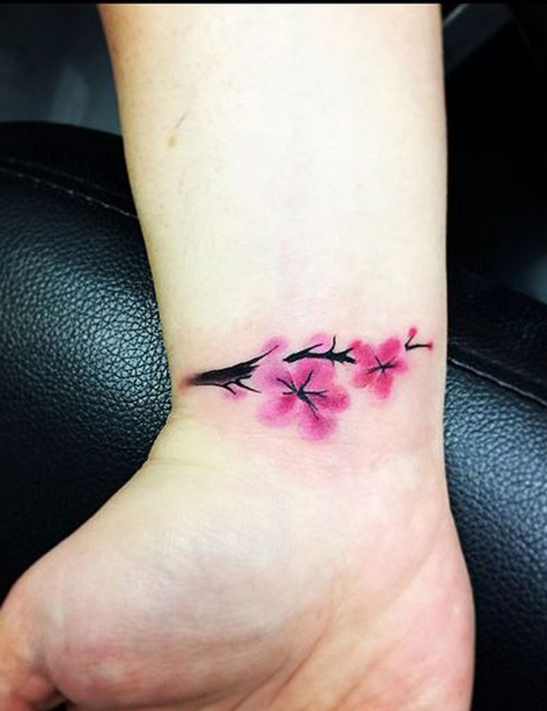Cute Watercolor Pink Floral Flower Cherry Blossom Wrist Tattoo Ideas for Women - www.MyBodiArt.com