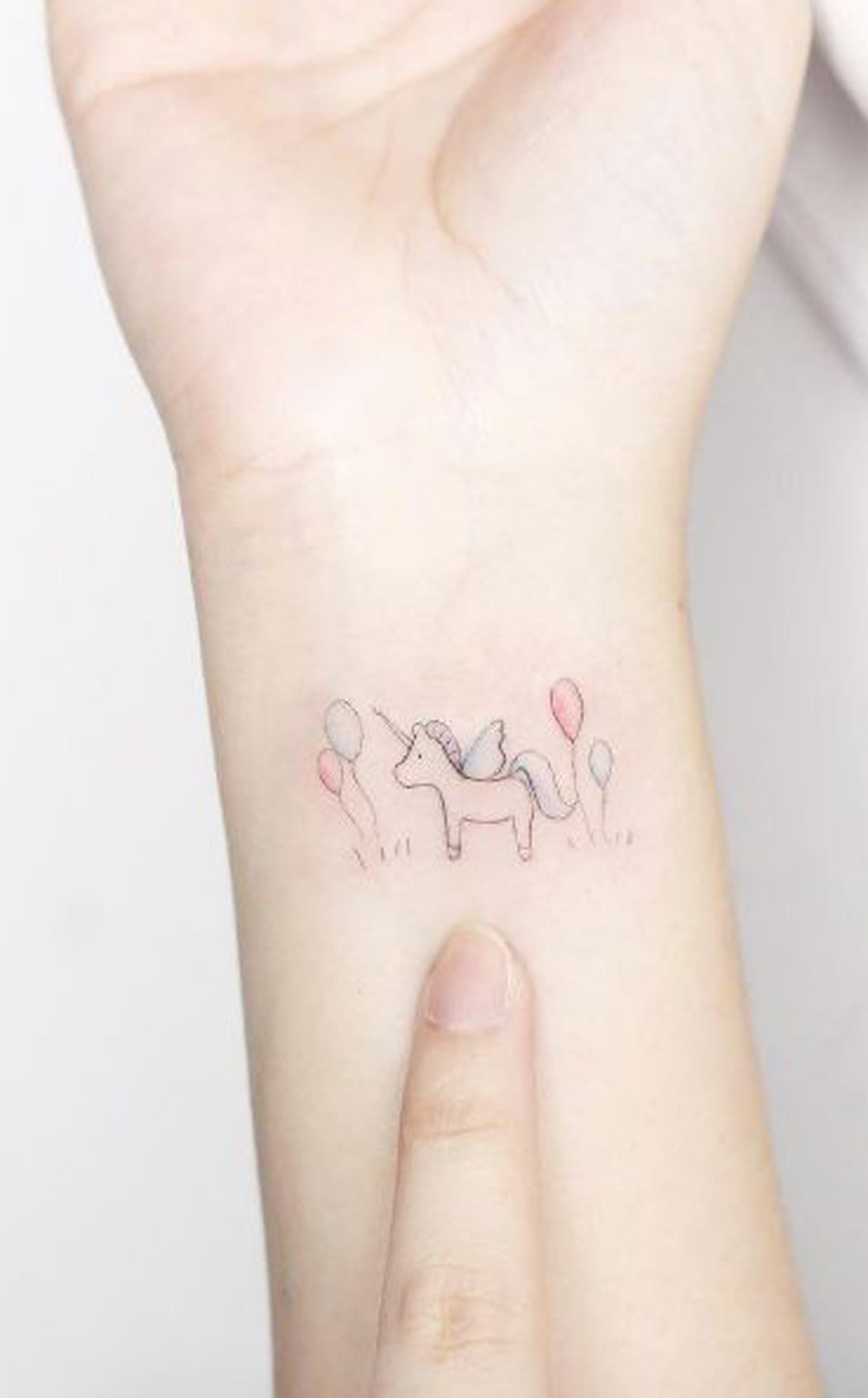 Small Wrist Tattoo Ideas for Women - Delicate Minimal Unicorn Balloons Arm Tatouage - Ideas Del Tatuaje - www.MyBodiArt.com 
